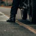 Rider wearing black motorcycle touring boots