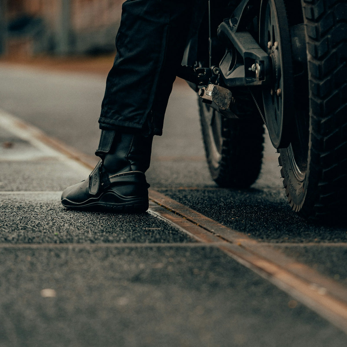 Rider wearing black motorcycle touring boots