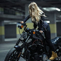 Rider in a black leather jacket on a cruiser motorcycle