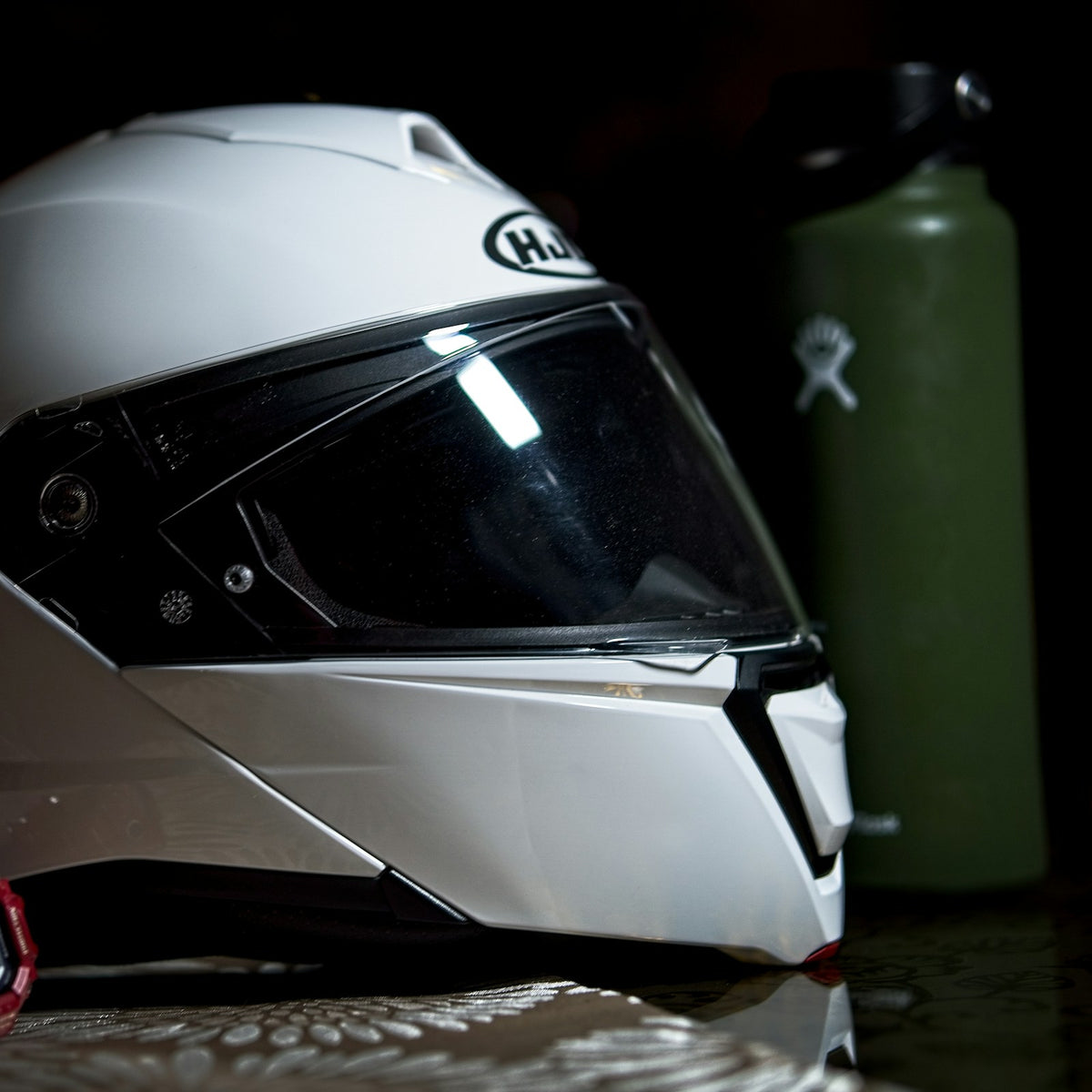 White and black modular flip-up motorcycle helmet