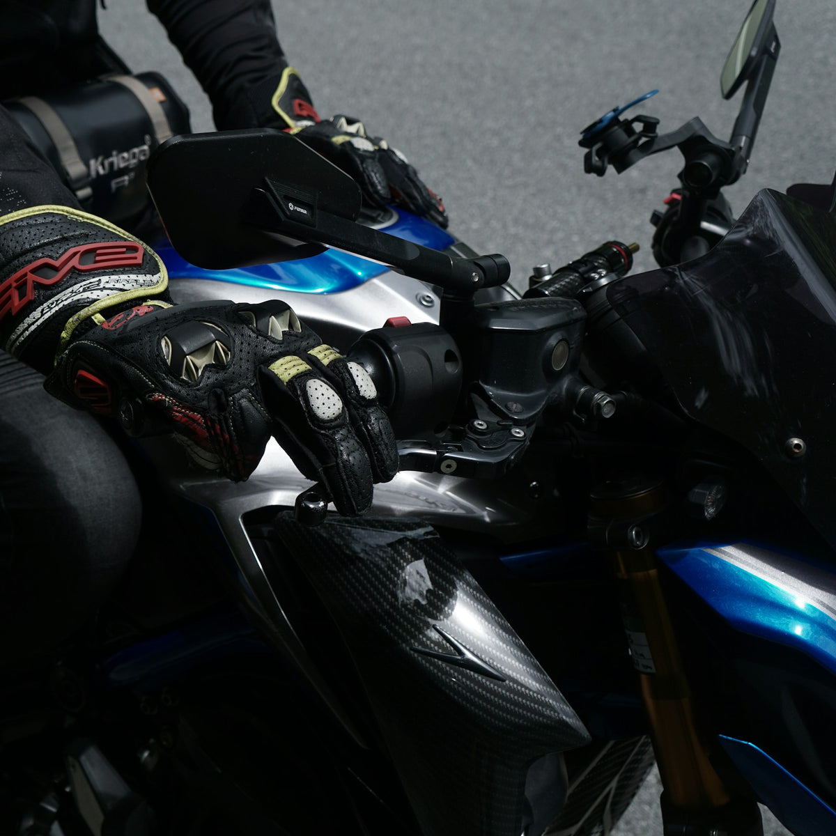 Rider wearing off-road gloves on the handlebars